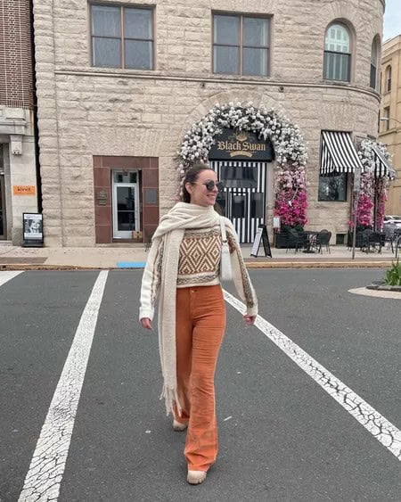 23 – Printed White Sweater With Orange Wide-Legged Denim Pants