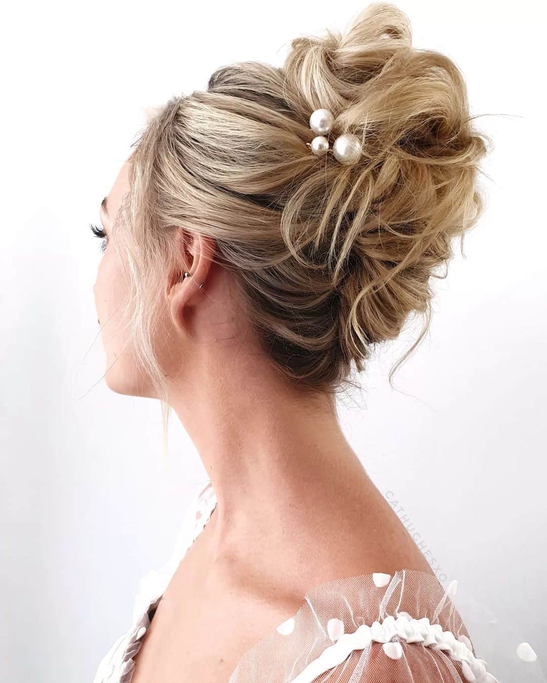 29 – Elegant High French Twist Bun