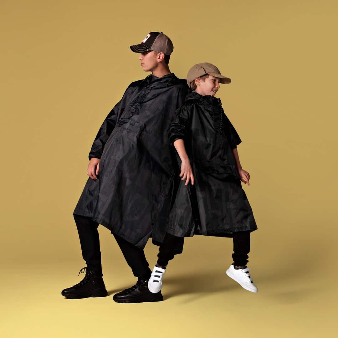 26 – Black-on-Black Poncho Raincoats