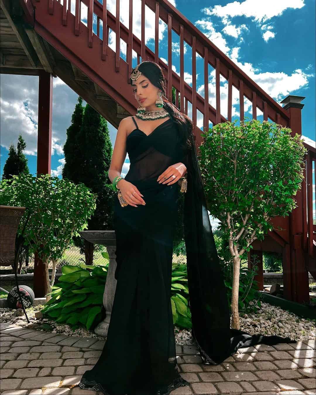 Plain Black Saree Styled with Contrasting Jewelry