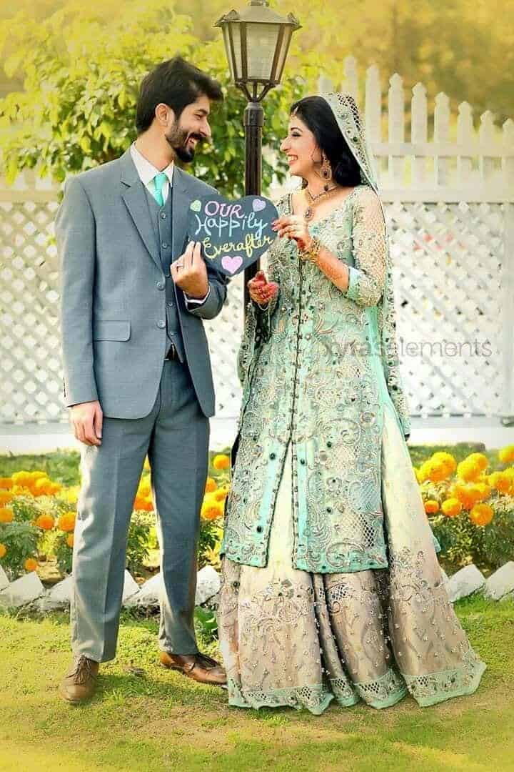 ↓ 173 – Romantic Couple Posing With Props On Wedding Day