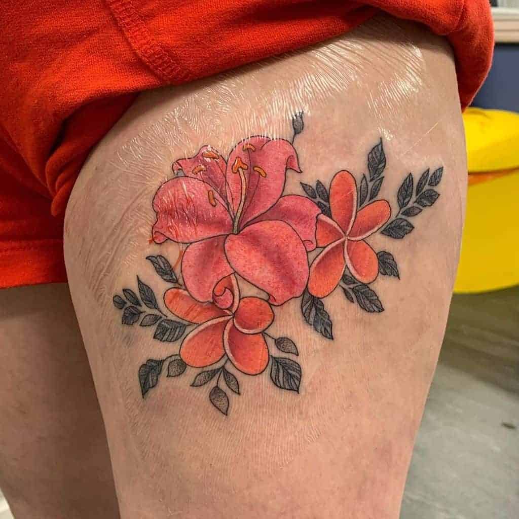 ↓ 18 – Colorful Frangipani Tattoos