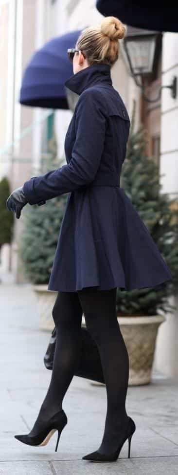 #10. With a Long Trench Coat and Chignon