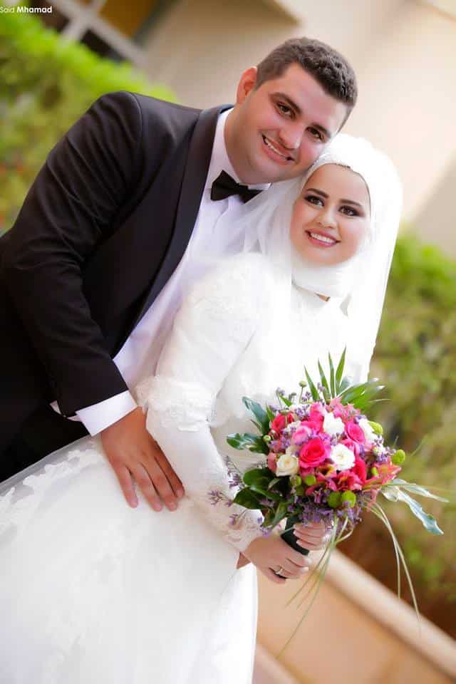 ↓ 107 – Muslim Bride In White Dress With Colorful Bouquet