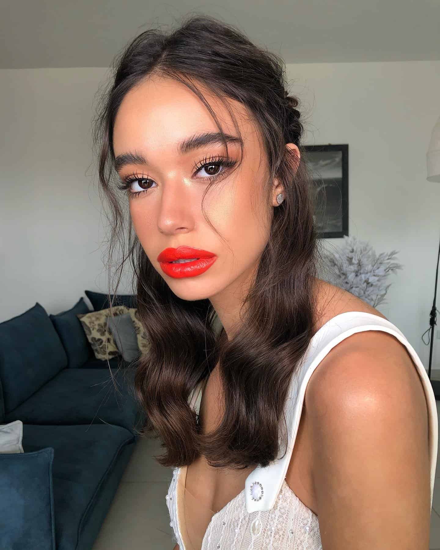 11 – The Iconic Orange-Red Lipstick