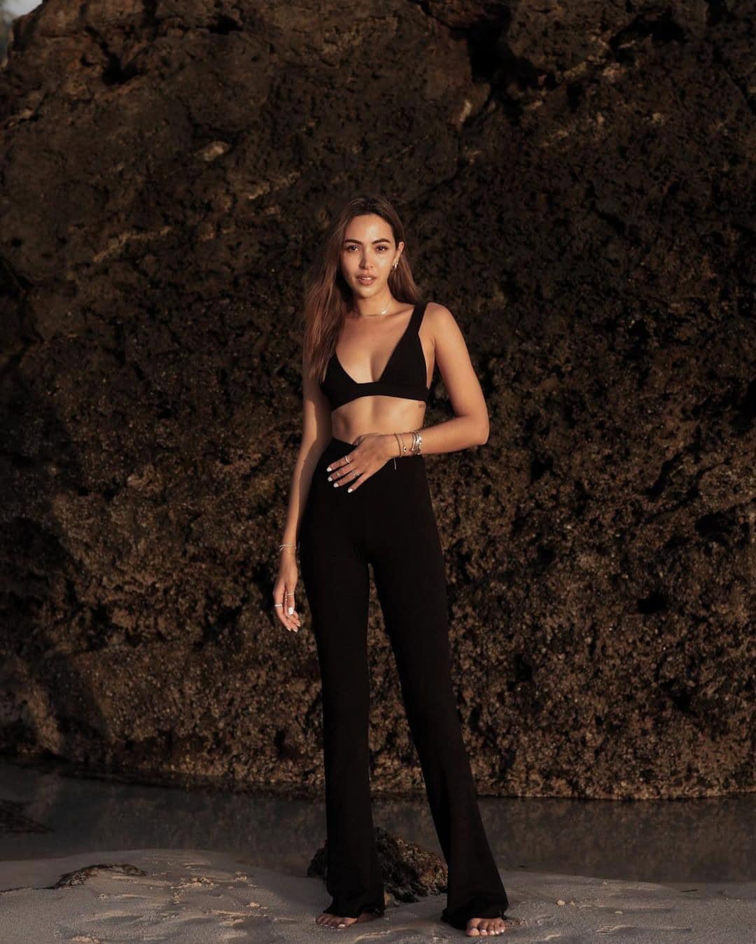 4 – A black Monochromatic String bikini top with high-waisted trousers