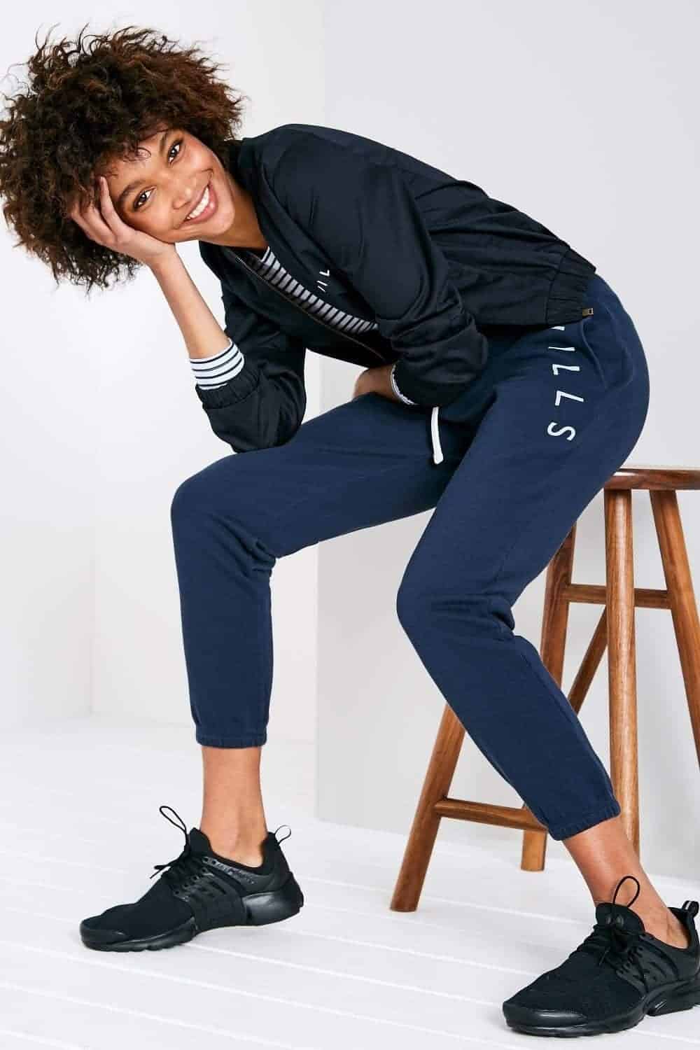 9 – Classic Black Sneakers With Sweatpants