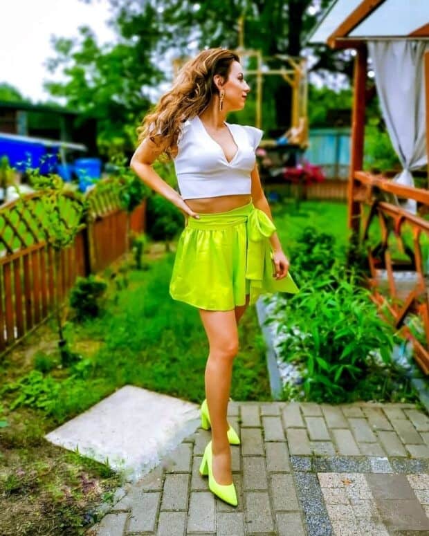 13 – Neon Green Skirt Under a White Top With Matching Neon Green Heels