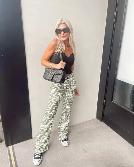 19 – Green Zebra Stripped Pants With an Off-Shoulder Black Top