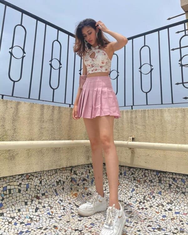 14 – Muted Pink Tennis Skirt with Lacey Floral Crossover Top Paired With White Sneakers