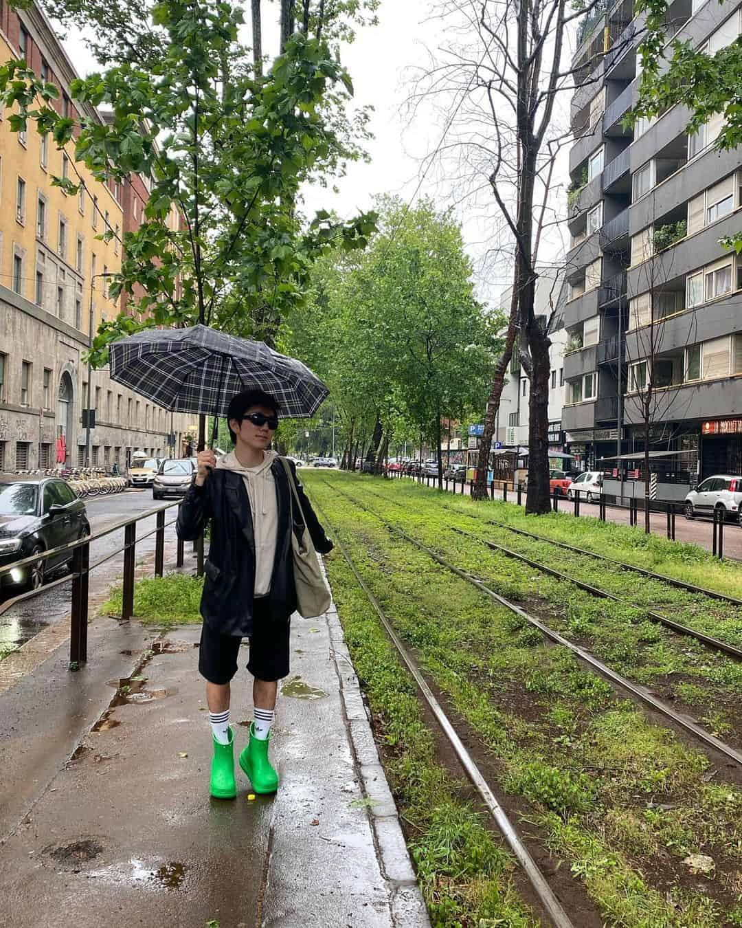 17 – Add a Hint of Color to a Muted Outfit with Bright Green Boots on a Rainy Day