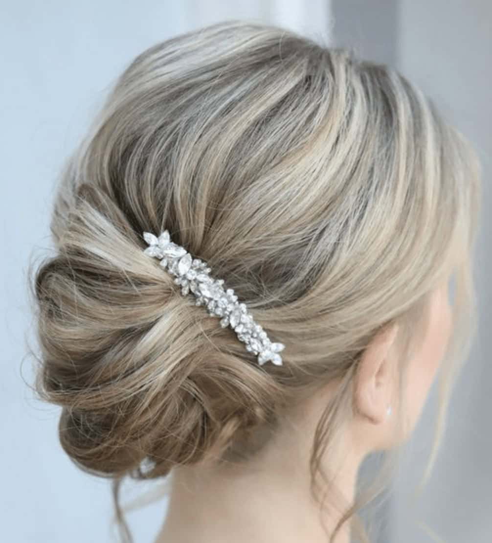 13 – Low Bun with Rhinestone Hair Clip Hairstyle Idea