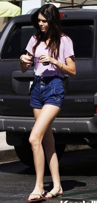 6 – High Waisted Buttoned Shorts With Purple Top