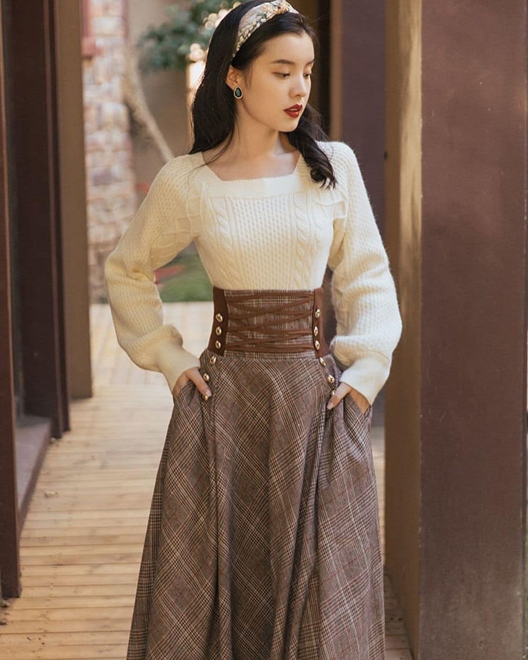 14 – Brown Plaid Skirt with a Corset Belt and Off-white Sweater