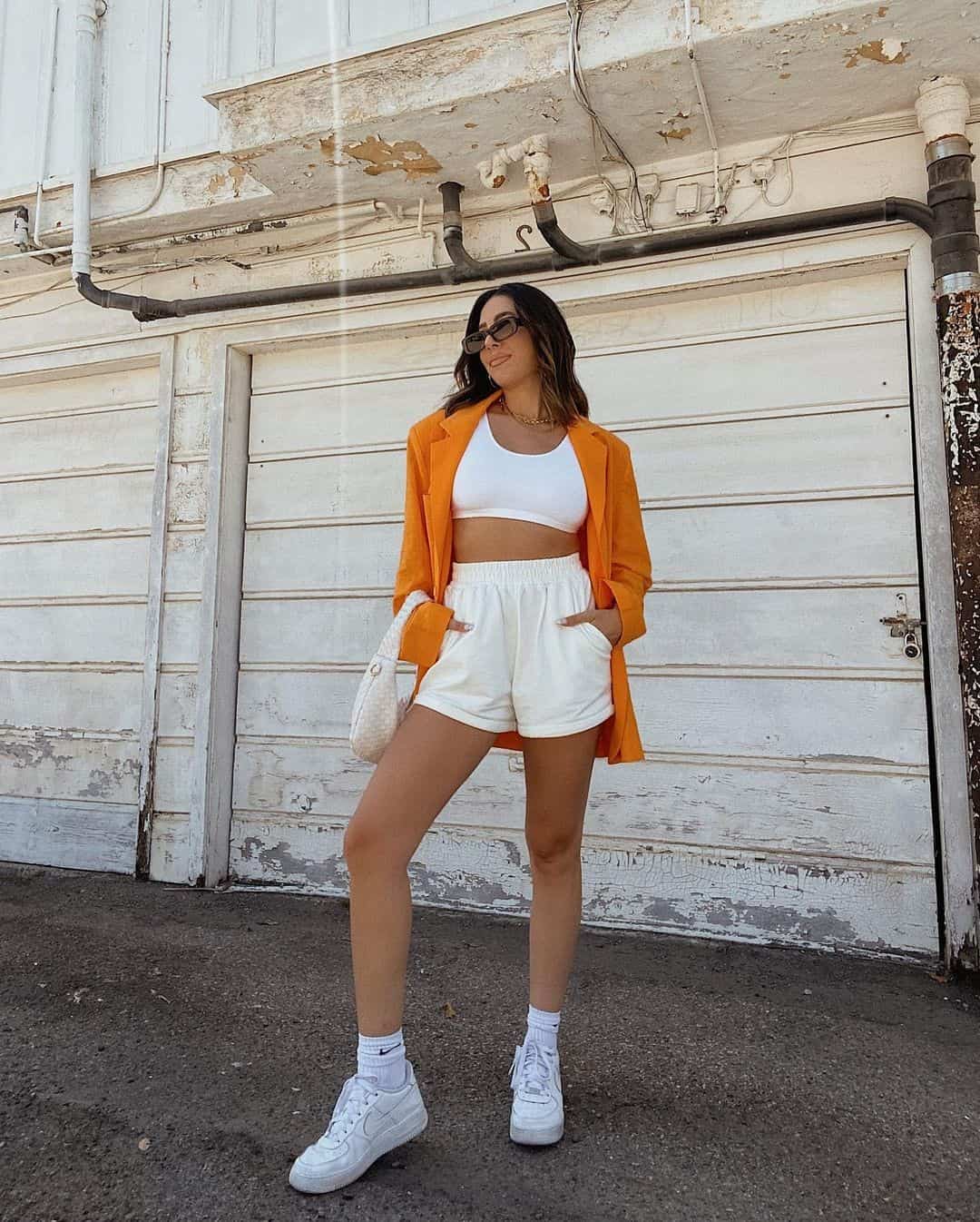 8 – White Sweatshorts & Top Layered With Orange Blazer