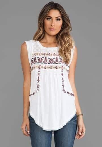 ↓ 20. Cross-Stitched Top with Skinny Jeans