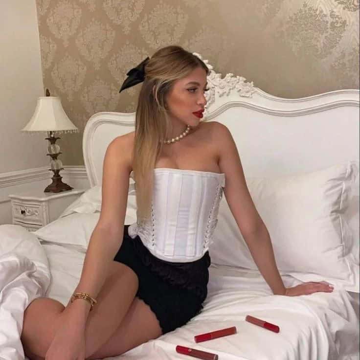 1 – White Corset Top with Black Skirt and Pearl Jewelry