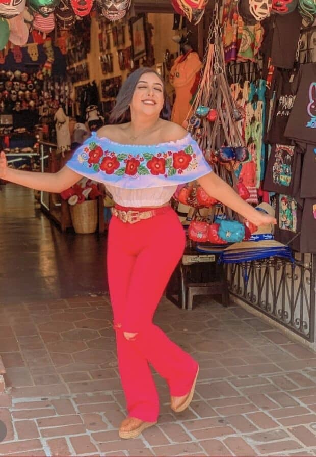 12 – White Off-Shoulder Crop Top With Bold Floral Embroidery Paired with Matching Red Flared Pants