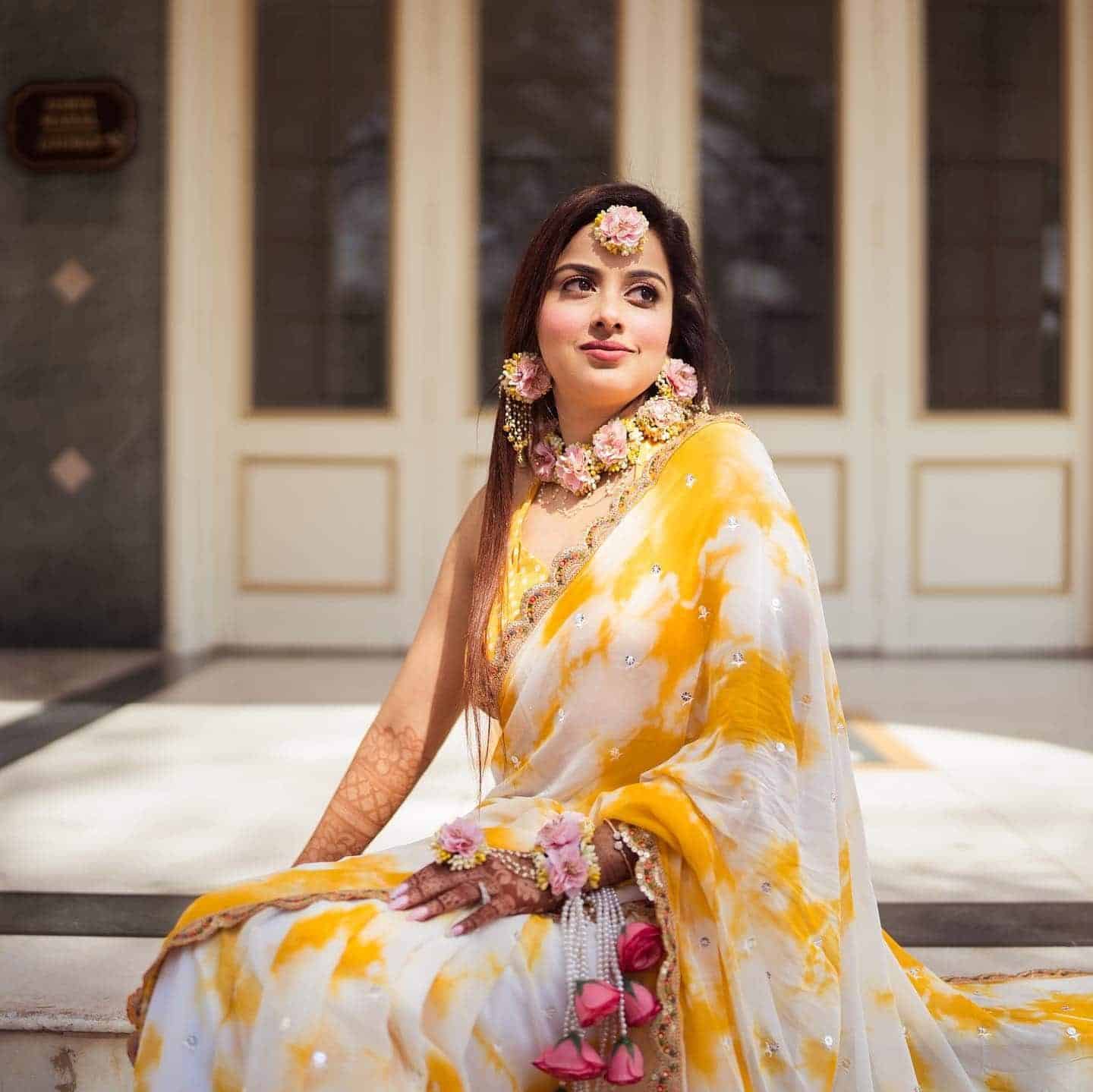 Yellow And White Tie Dye Saree Paired with Floral Kaleere