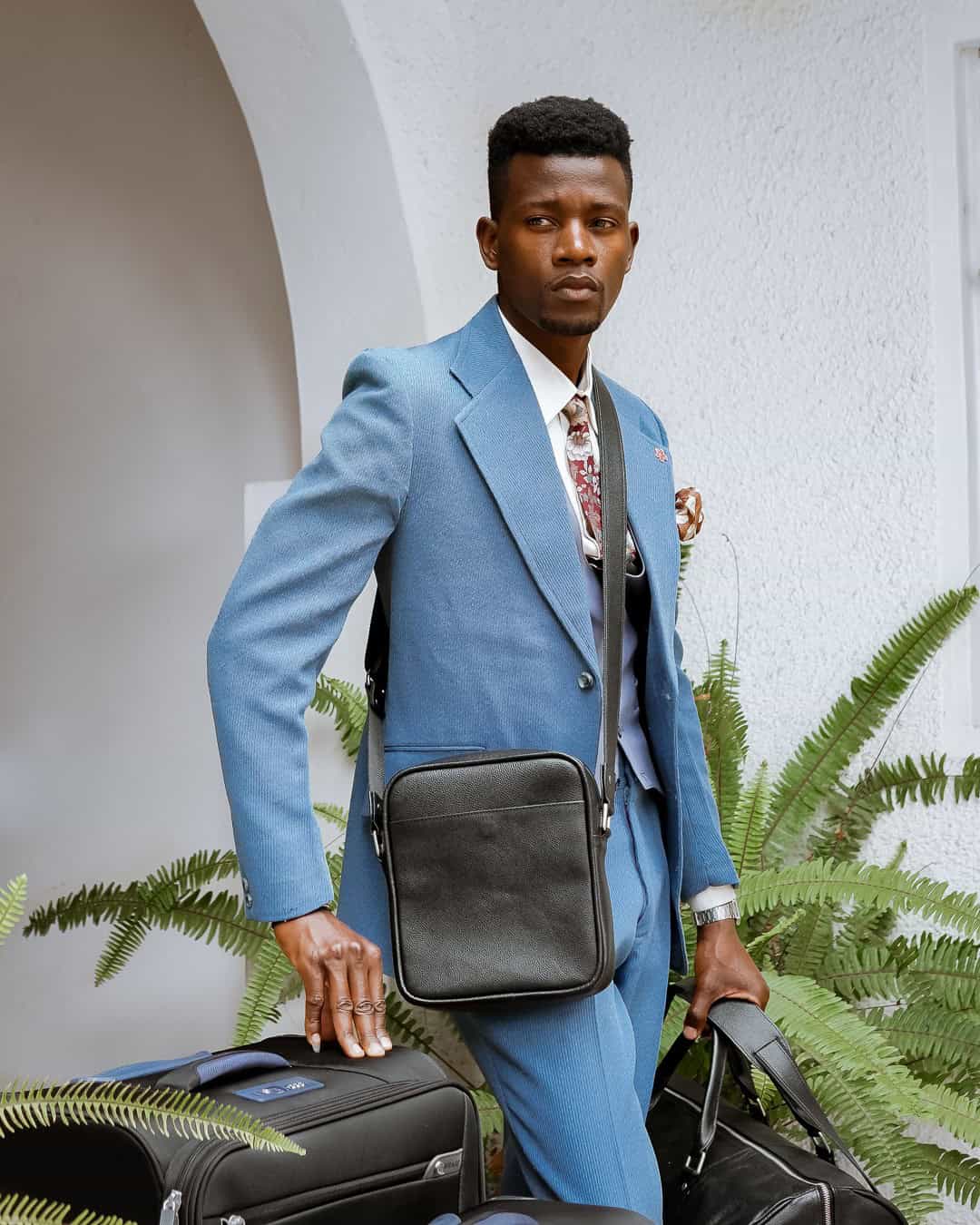 7 – Go with Blue Suit and A Large Cross Body Bags