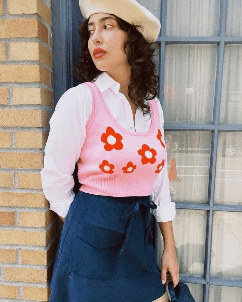 9 – A Printed Vest With A White Button Up and Blue Skirt