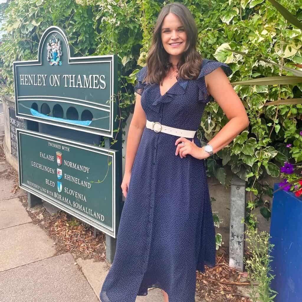 11 – Blue Flowy Dress WIth Ruffled Neckline and White Belt