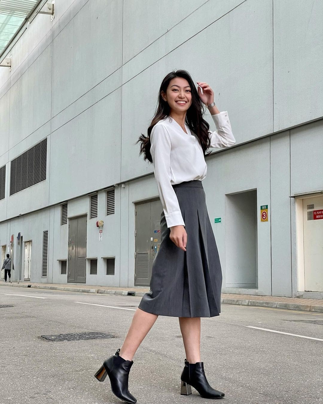 11 – Pleated Skirt With White Button Down Top and Black Boots