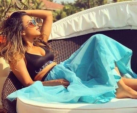 ↓ 35 – Nia Sharma Enjoying At The Beach In A Blue Skirt