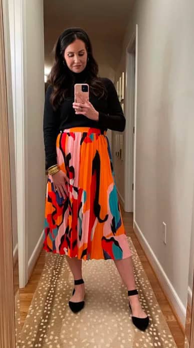 17 – Orange Printed Skirt With A Black Polo Neck